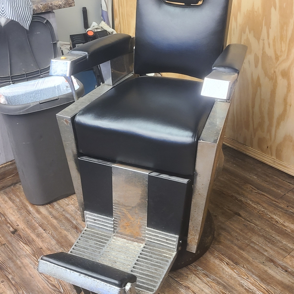 Sleek Black and Silver Barber Chair